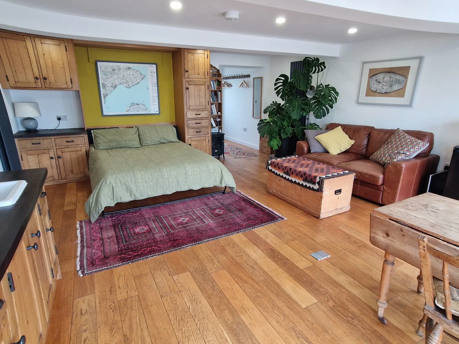 Low Tide open-plan studio with bed and sofa